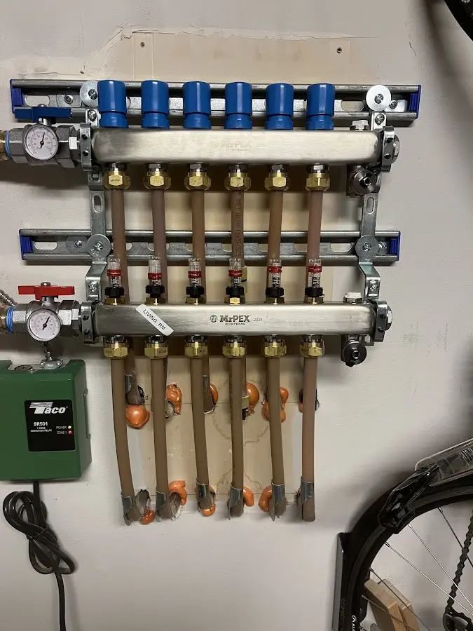 Plumber performing Water Heater Repair at a residential property in Eliot